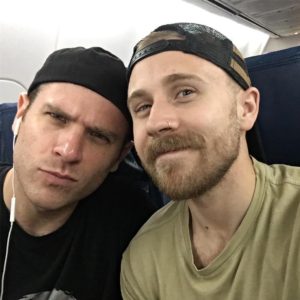 scott evans and his boyfriend zach volin enjoying in a flight