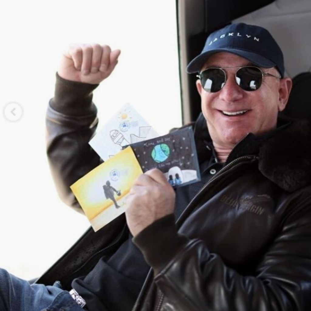 Jeff Bezos showing off ticket of his space tour with New Shepard